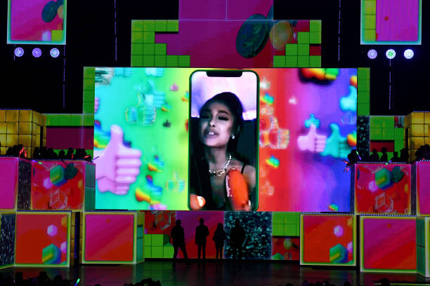 Ariana Grande accepts the awards for Favorite Female Artist and Favorite Song for "Thank U, Next" during Nickelodeon's 2