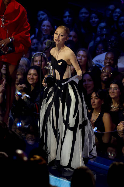 Ariana Grande accepts the Best Pop Award for “Brighter Days Ahead” onstage during the 2025 MTV Video Music Awards at UBS Arena on September 07, 2025 in Elmont, New York. (408×612)