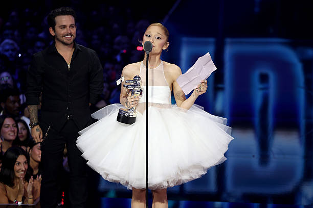 Ariana Grande accepts the Video of the Year Award for “Brighter Days Ahead” onstage with Christian Breslauer during the 2025 MTV Video Music Awards at UBS Arena on September 07, 2025 in Elmont, New York. — frame 220/246 (612×408)