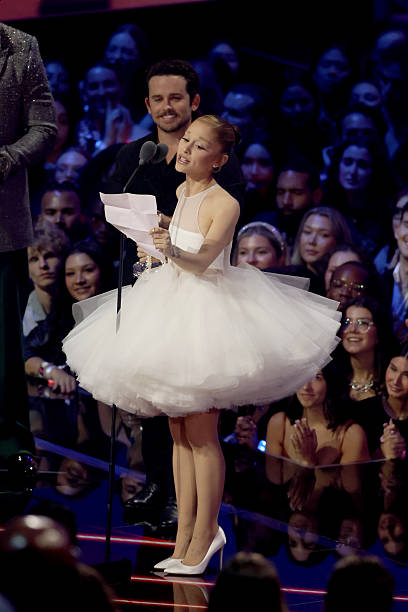 Ariana Grande accepts the Video of the Year Award for “Brighter Days Ahead” onstage with Christian Breslauer during the 2025 MTV Video Music Awards at UBS Arena on September 07, 2025 in Elmont, New York. — frame 139/246 (408×612)