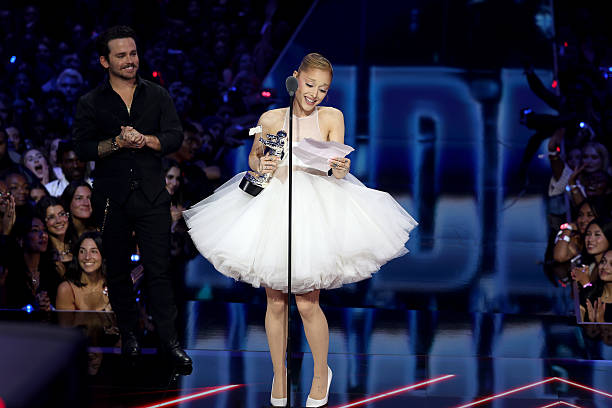 Ariana Grande accepts the Video of the Year Award for “Brighter Days Ahead” onstage with Christian Breslauer during the 2025 MTV Video Music Awards at UBS Arena on September 07, 2025 in Elmont, New York. — frame 219/246 (612×408)