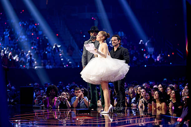 Ariana Grande and Christian Breslauer accept the Video of the Year Award for “Brighter Days Ahead” from LL Cool J during the 2025 MTV Video Music Awards at UBS Arena on September 07, 2025 in Elmont, New York. — frame 138/246 (612×408)