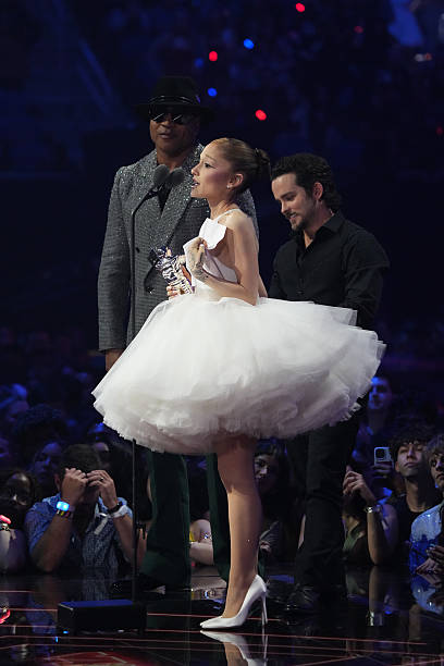 Ariana Grande and Christian Breslauer accept the Video of the Year Award for “Brighter Days Ahead” from LL Cool J during the 2025 MTV Video Music Awards at UBS Arena on September 07, 2025 in Elmont, New York. (408×612)
