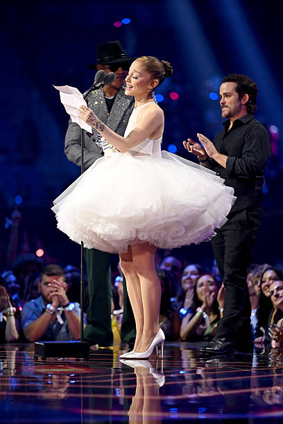 Ariana Grande and Christian Breslauer accept the Video of the Year Award for “Brighter Days Ahead” from LL Cool J during the 2025 MTV Video Music Awards at UBS Arena on September 07, 2025 in Elmont, New York. (408×612)