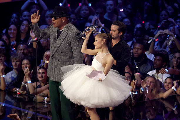 Ariana Grande and Christian Breslauer accept the Video of the Year Award for “Brighter Days Ahead” from LL Cool J onstage during the 2025 MTV Video Music Awards at UBS Arena on September 07, 2025 in Elmont, New York. (612×408)