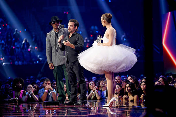 Ariana Grande and Christian Breslauer accept the Video of the Year Award for “Brighter Days Ahead” from LL Cool J during the 2025 MTV Video Music Awards at UBS Arena on September 07, 2025 in Elmont, New York. — frame 140/246 (612×408)