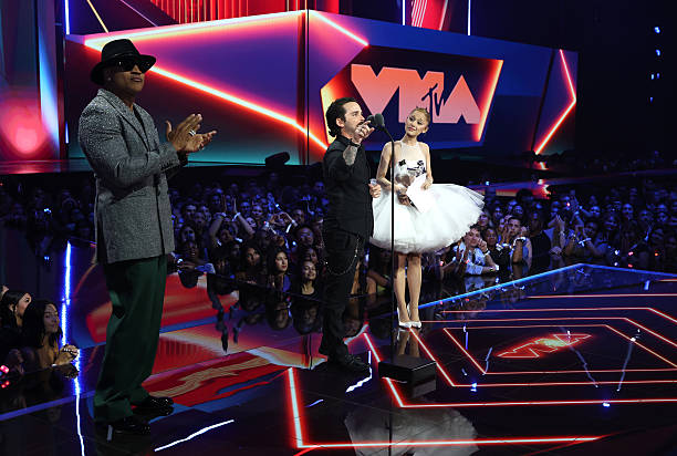 Ariana Grande and Christian Breslauer accept the Video of the Year Award for “Brighter Days Ahead” from LL Cool J during the 2025 MTV Video Music Awards at UBS Arena on September 07, 2025 in Elmont, New York. (612×412)