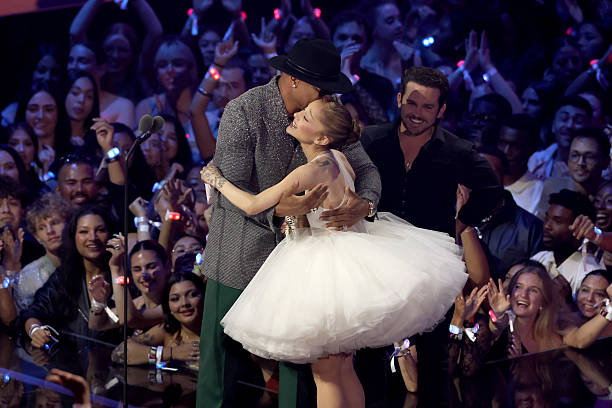 Ariana Grande and Christian Breslauer accept the Video of the Year Award for “Brighter Days Ahead” from LL Cool J onstage during the 2025 MTV Video Music Awards at UBS Arena on September 07, 2025 in Elmont, New York. (612×408)