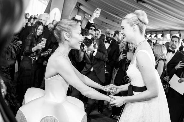 Ariana Grande and Elle Fanning attend the 97th annual Oscars at Ovation Hollywood on March 02, 2025 in Hollywood, California. — frame 122/202 (612×408)