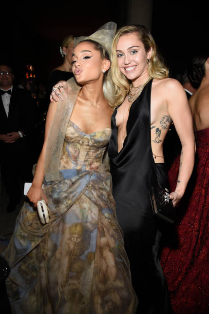 Ariana Grande and Miley Cyrus attend the Heavenly Bodies: Fashion & The Catholic Imagination Costume Institute Gala at T