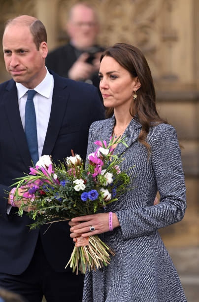 Catherine, Duchess of Cambridge and Prince William, Duke of Cambridge depart after attending the official opening of the Glade of Light Memorial at Manchester Cathedral on May 10, 2022 in Manchester, England. The Glade of Light Memorial commemorates the victims of the terrorist attack that took place after an Ariana Grande concert at Manchester Arena on May 22, 2017. (404×612)