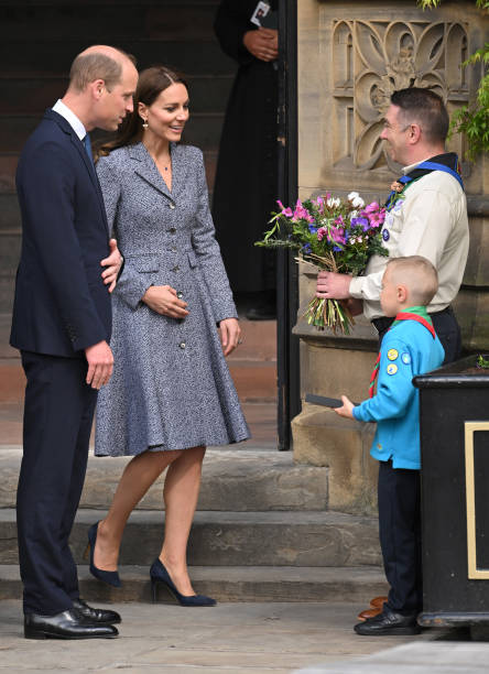 Catherine, Duchess of Cambridge and Prince William, Duke of Cambridge depart after attending the official opening of the Glade of Light Memorial at Manchester Cathedral on May 10, 2022 in Manchester, England. The Glade of Light Memorial commemorates the victims of the terrorist attack that took place after an Ariana Grande concert at Manchester Arena on May 22, 2017. (444×612)