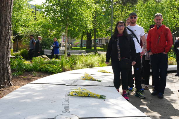 Figen Murray, the mother of victim Martyn Hett, with her husband Stuart at the memorial outside the Manchester Cathedral commemorating those who died in the Manchester Arena bombing as she begins a 200-mile walk to Downing Street to demand the introduction of Martyn's Law for stronger protections against terrorism in public places. Martyn's Law, named in tribute to the 29-year-old who was one of 22 people killed at the end of an Ariana Grande concert in May 2017, would require venues and local authorities in the UK to have preventative plans against terror attacks. Picture date: Tuesday May 7, 2024. — frame 3/5 (612×408)