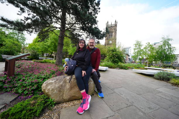 Figen Murray, the mother of victim Martyn Hett, with her husband Stuart at the memorial outside the Manchester Cathedral
