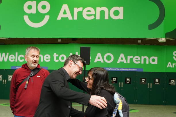 Greater Manchester mayor Andy Burnham hugs Figen Murray, the mother of Manchester Arena bombing victim Martyn Hett, outside the Manchester Arena before she begins a 200-mile walk to Downing Street to demand the introduction of Martyn's Law for stronger protections against terrorism in public places. Martyn's Law, named in tribute to the 29-year-old who was one of 22 people killed at the end of an Ariana Grande concert in May 2017, would require venues and local authorities in the UK to have preventative plans against terror attacks. Picture date: Tuesday May 7, 2024. (612×407)