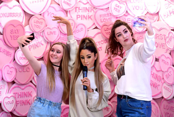 Heather and Grace pose with the waxwork of Ariana Grande at the unveiling of Ariana Grande's wax figure at Madame Tussauds, London. (612×411)