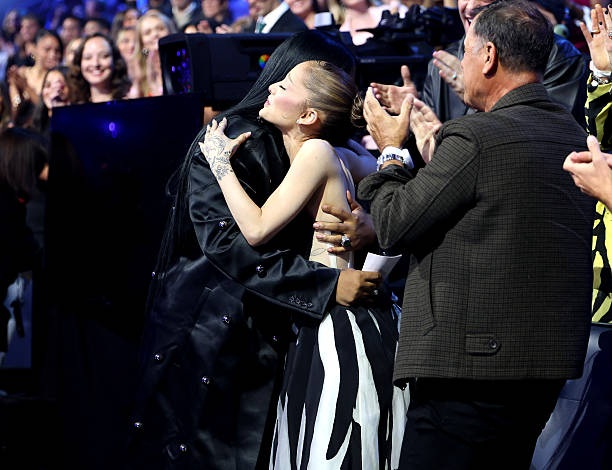 Ariana Grande hugs Law Roach before accepting the Best Pop Award for “Brighter Days Ahead” during the 2025 MTV Video Music Awards at UBS Arena on September 07, 2025 in Elmont, New York. — frame 235/246 (612×470)