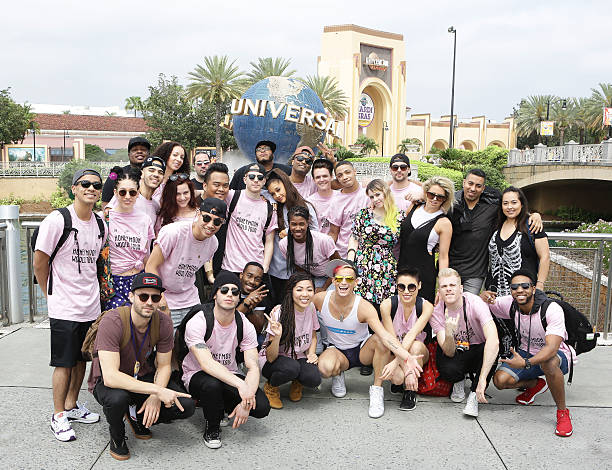 In this handout photo provided by Universal Orlando Resort, pop-superstar Ariana Grande and her Honeymoon Tour crew pose for a group photo at the iconic Universal globe while visiting Universal Orlando Resort on March 25 in Orlando, Florida. During their hosted visit they explored both theme parks and enjoyed marquee attractions including the Hollywood Rip Ride Rockit, The Amazing Adventures of Spider-Man and The Wizarding World of Harry Potter - Diagon Alley. (612×470)