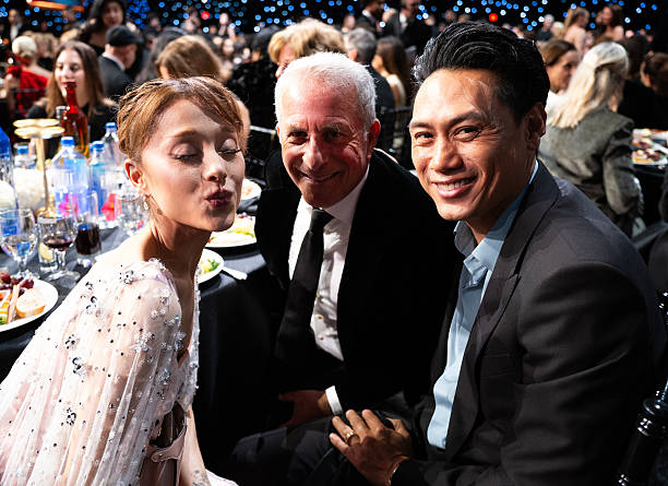 Ariana Grande, Marc Platt, and Jon M. Chu attend the 31st Annual Critics Choice Awards at Barker Hangar on January 04, 2026 in Santa Monica, California. (612×445)
