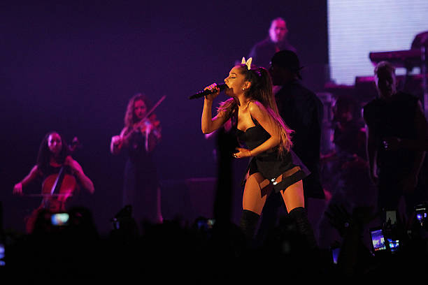 Ariana Grande performs live in Jakarta, Wednesday, August 26, 2015 at a concert that titled "The Honeymoon Tour." Ariana Grande is a American singer and actress. Her album's lead single, "The Way", became a top ten hit on the Billboard Hot 100, with critics comparing her wide vocal range to Mariah Carey. Her second studio album, My Everything , also reached number one in the United States. It contained the singles "Problem" and "Break Free". With songs "Break Free", "Problem", "Bang Bang" and "Love Me Harder", she spent 34 continuous weeks in the top ten of the Billboard Hot 100[3] and had the most top 10 singles of any artist in 2014. (612×408)