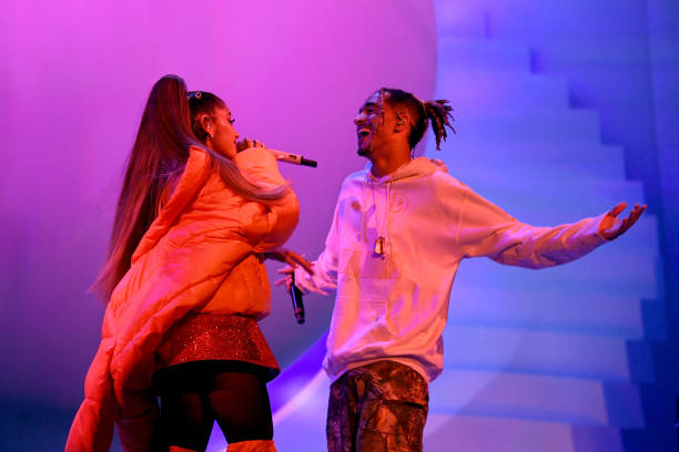 Ariana Grande performs on stage with Mikey Foster of Social House during her "Sweetener World Tour" at The O2 Arena on A