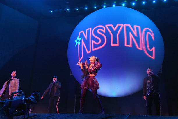 Ariana Grande performs with members of NSYNC Lance Bass, Joey Fatone and Chris Kirkpatrick on Coachella Stage during the