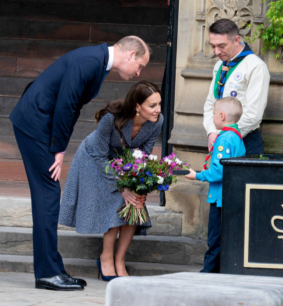 Prince William, Duke of Cambridge, and Catherine, Duchess of Cambridge, depart after attending the official opening of the Glade of Light Memorial at Manchester Cathedral on May 10, 2022 in Manchester, England. The Glade of Light Memorial commemorates the victims of the terrorist attack that took place after an Ariana Grande concert at Manchester Arena on May 22, 2017. (567×612)