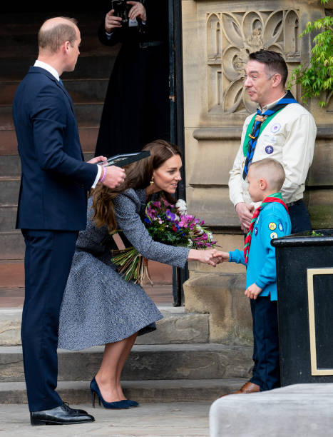 Prince William, Duke of Cambridge, and Catherine, Duchess of Cambridge, depart after attending the official opening of the Glade of Light Memorial at Manchester Cathedral on May 10, 2022 in Manchester, England. The Glade of Light Memorial commemorates the victims of the terrorist attack that took place after an Ariana Grande concert at Manchester Arena on May 22, 2017. (467×612)