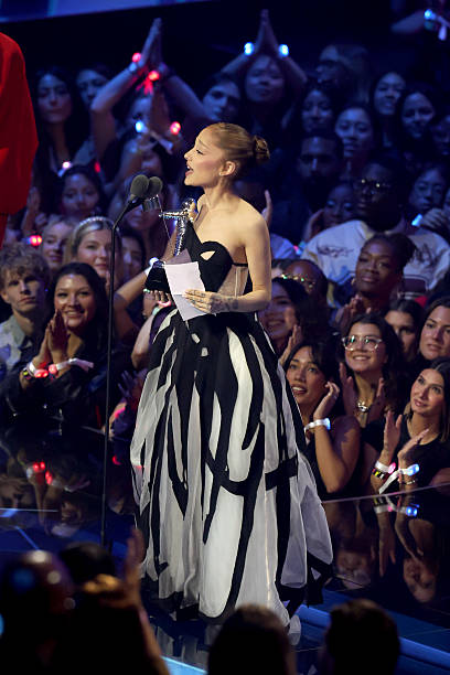 Ariana Grande speaks onstage during the 2025 MTV Video Music Awards at UBS Arena on September 07, 2025 in Elmont, New York. — frame 113/246 (408×612)