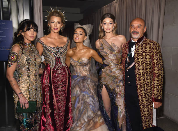 Blake Lively , Ariana Grande , Gigi Hadid and designer Christian Louboutin attend the Heavenly Bodies: Fashion & The Catholic Imagination Costume Institute Gala at The Metropolitan Museum of Art on May 7, 2018 in New York City. (612×450)