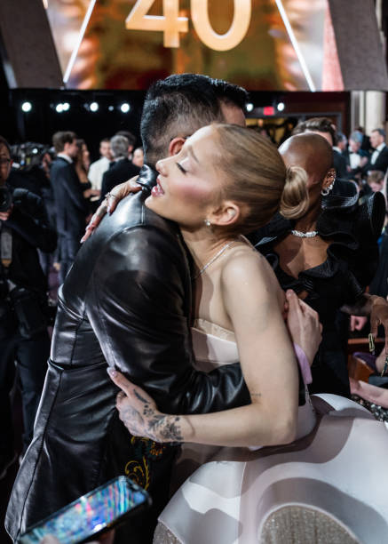 Bowen Yang and Ariana Grande attend the 97th Annual Oscars at Dolby Theatre on March 02, 2025 in Hollywood, California