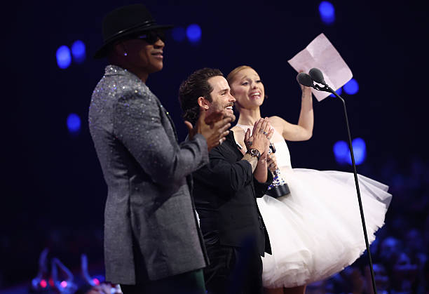 Christian Breslauer and Ariana Grande accept the Video of the Year Award for “Brighter Days Ahead” onstage during the 2025 MTV Video Music Awards at UBS Arena on September 07, 2025 in Elmont, New York. (612×419)