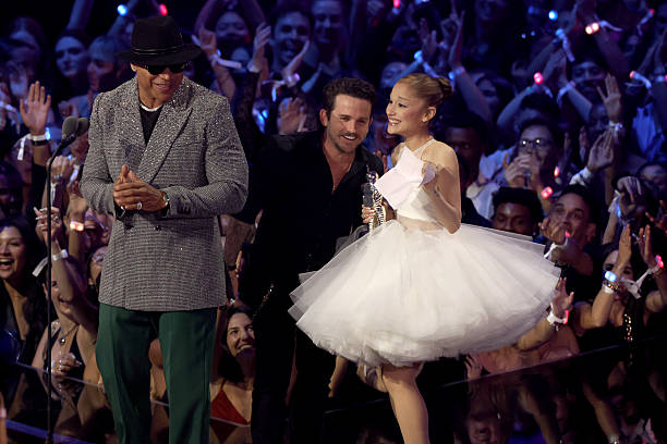 Christian Breslauer and Ariana Grande accept the Video of the Year Award for “Brighter Days Ahead” from LL Cool J onstage during the 2025 MTV Video Music Awards at UBS Arena on September 07, 2025 in Elmont, New York. (612×408)