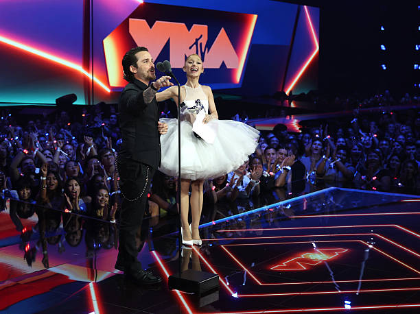 Christian Breslauer and Ariana Grande accepts the Video of the Year Award for “Brighter Days Ahead” during the 2025 MTV Video Music Awards at UBS Arena on September 07, 2025 in Elmont, New York. — frame 162/246 (612×458)