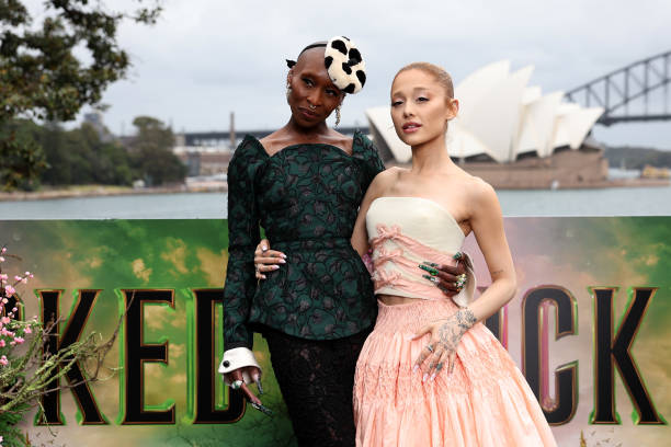 Cynthia Erivo and Ariana Grande pose for a photocall at Mrs Macquarie's Chair during the Australian premiere of "Wicked"