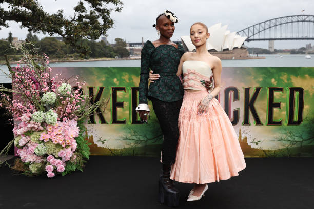 Cynthia Erivo and Ariana Grande pose for a photocall at Mrs Macquarie's Chair during the Australian premiere of "Wicked"