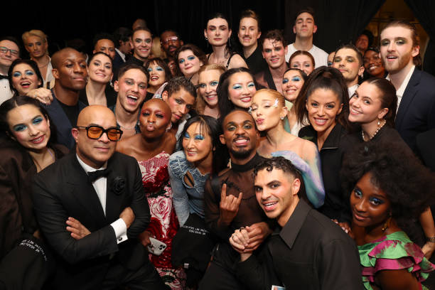 Cynthia Erivo and Ariana Grande pose with dancers and crew backstage during The 2024 Met Gala Celebrating "Sleeping Beauties: Reawakening Fashion" at The Metropolitan Museum of Art on May 06, 2024 in New York City. — frame 182/236 (612×408)