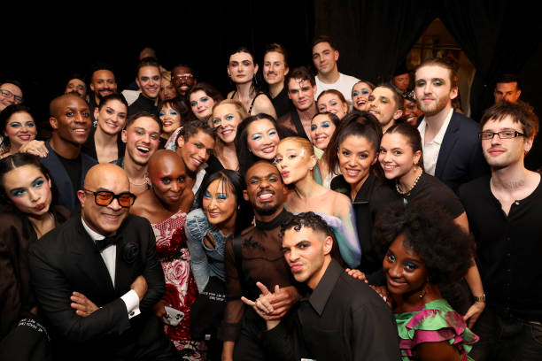 Cynthia Erivo and Ariana Grande pose with dancers and crew backstage during The 2024 Met Gala Celebrating "Sleeping Beauties: Reawakening Fashion" at The Metropolitan Museum of Art on May 06, 2024 in New York City. — frame 183/236 (612×408)