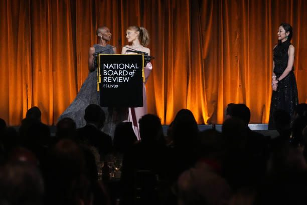 Cynthia Erivo, Ariana Grande, Michelle Yeoh speak onstage at The National Board of Review Gala held at Cipriani on January 7, 2025 in New York, New York. — frame 54/76 (612×409)