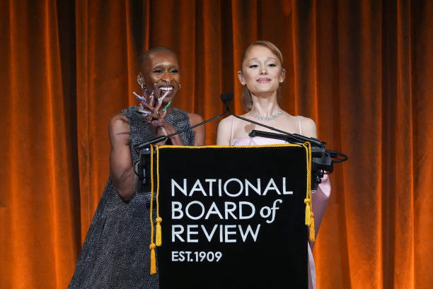 Cynthia Erivo, Ariana Grande speak onstage at The National Board of Review Gala held at Cipriani on January 7, 2025 in New York, New York. — frame 59/76 (612×409)