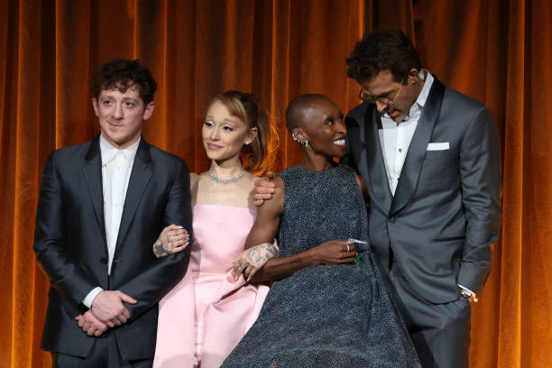 Ethan Slater, Ariana Grande, and Cynthia Erivo accept the Best Film Award for "Wicked" from Ryan Reynolds onstage during The National Board of Review Annual Awards Gala at Cipriani 42nd Street on January 07, 2025 in New York City. — frame 68/110 (612×408)