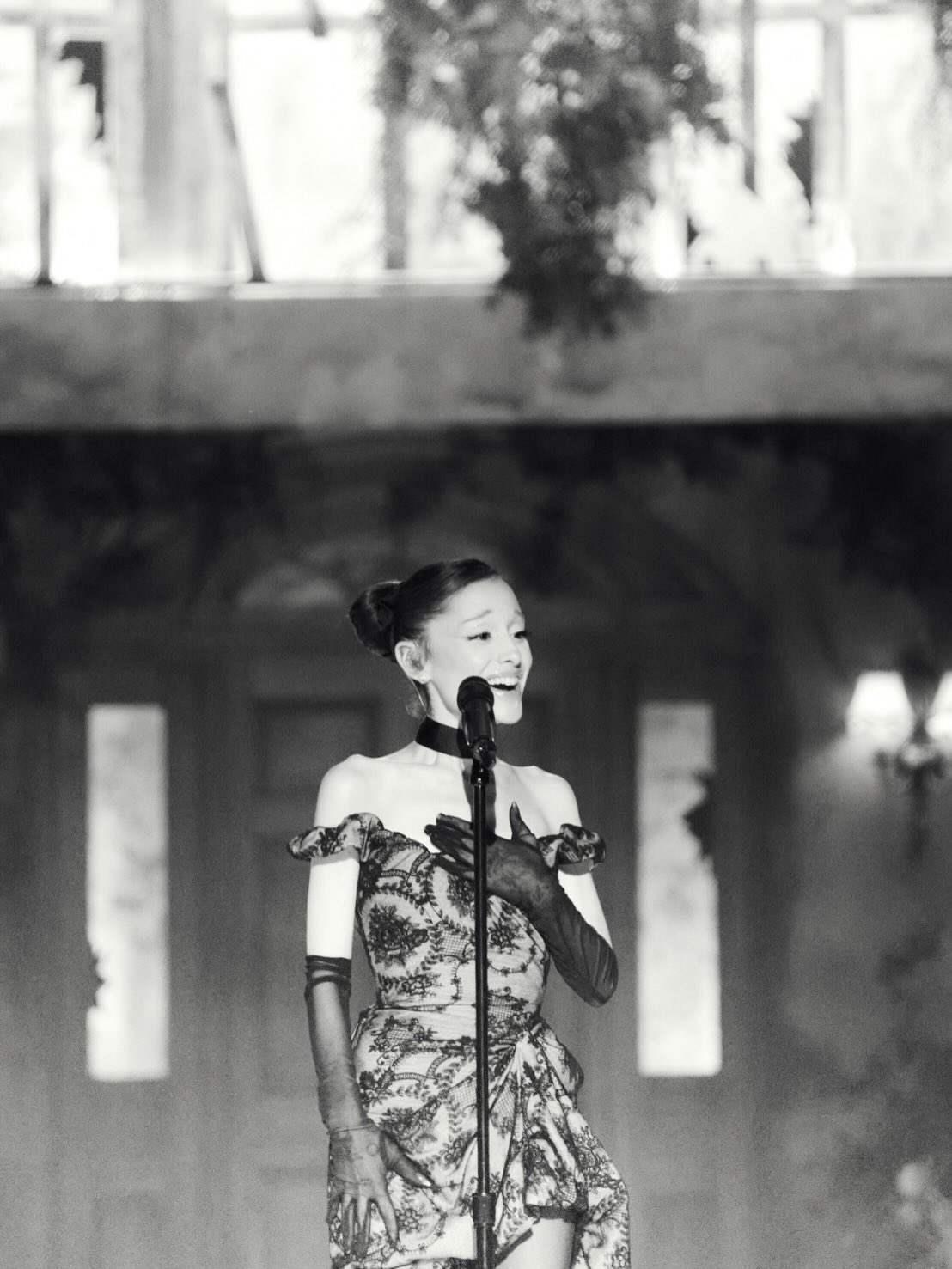May be a black-and-white image of one or more people, makeup, dress and text