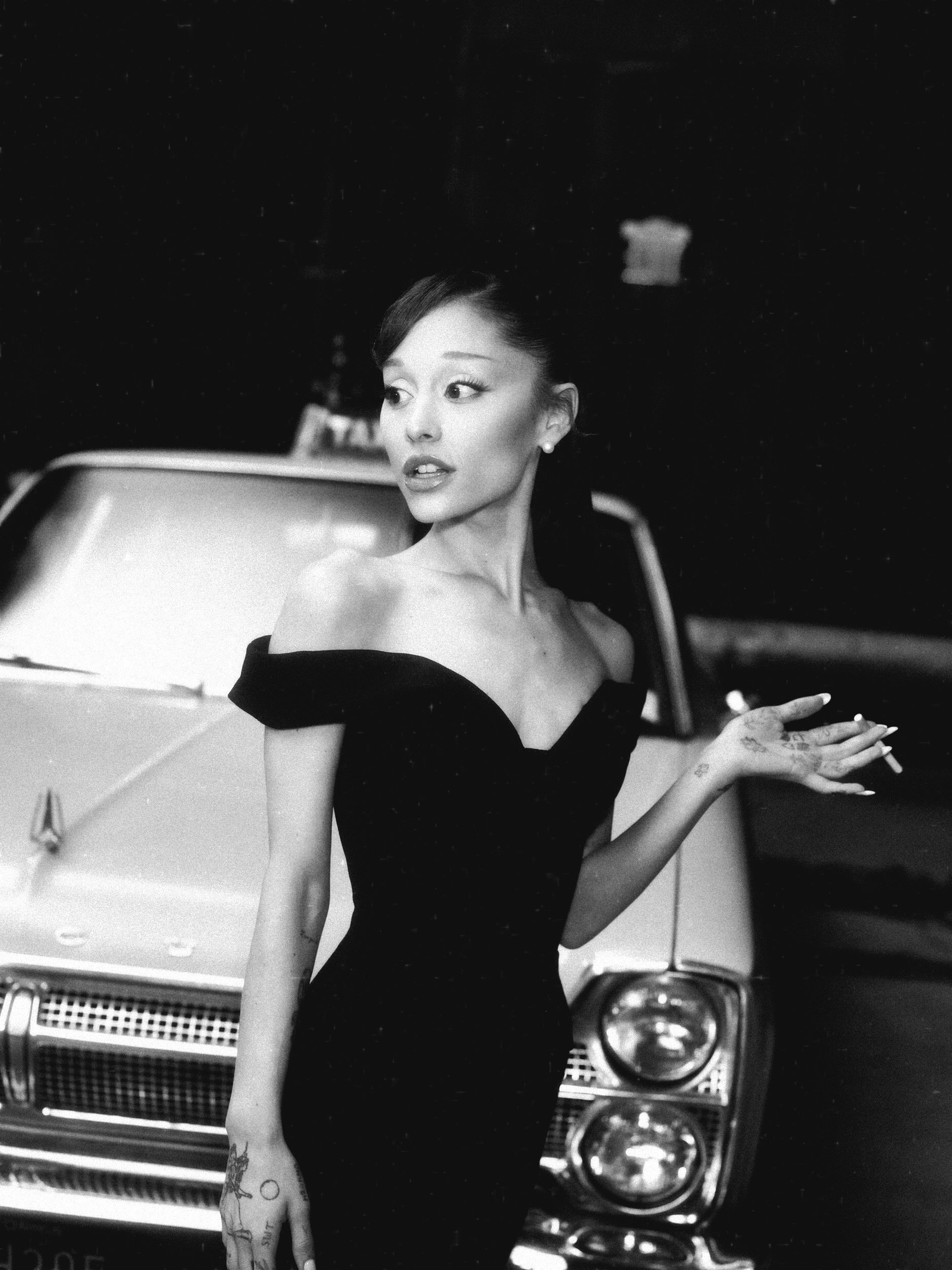 May be a black-and-white image of one or more people, makeup, dress and text