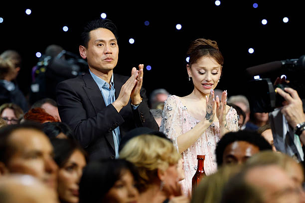 Jon M. Chu and Ariana Grande applaud as B"KPop Demon Hunters" wins Best Song Award for 'Golden' the 31st Annual Critics Choice Awards at Barker Hangar on January 04, 2026 in Santa Monica, California. — frame 93/105 (612×408)