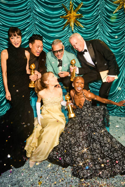 Michelle Yeoh, Jon M. Chu, Ariana Grande, Jeff Goldblum, Marc E. Platt, Cynthia Erivo photographed backstage during the 82nd Annual Golden Globes held at the Beverly Hilton on January 05, 2025 in Beverly Hills, California. (408×612)