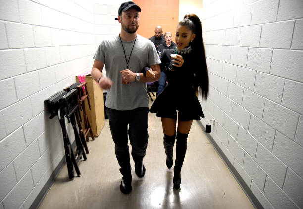 Scooter Braun and Ariana Grande walk backstage during the "Dangerous Woman" Tour Opener at Talking Stick Resort Arena on February 3, 2017 in Phoenix, Arizona. (612×423)