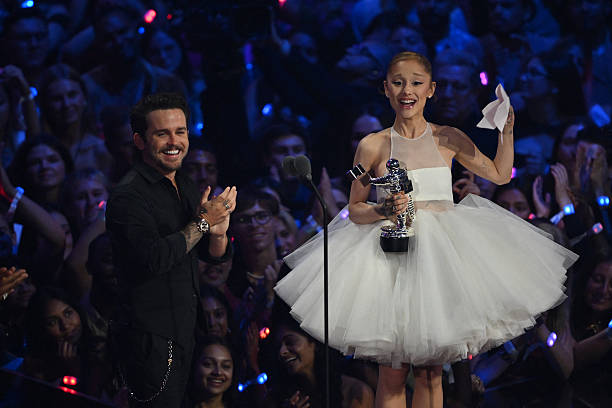 Singer-songwriter Ariana Grande and US music video director Christian Breslauer accept the award for Video of the Year for "Brighter Days Ahead" on stage during the MTV Video Music Awards at UBS Arena in Elmont, New York, on September 7, 2025. — frame 106/109 (612×408)