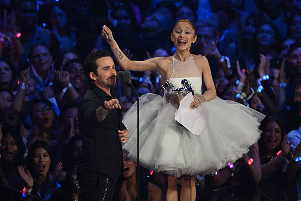 Singer-songwriter Ariana Grande and US music video director Christian Breslauer accept the award for Video of the Year for "Brighter Days Ahead" on stage during the MTV Video Music Awards at UBS Arena in Elmont, New York, on September 7, 2025. — frame 105/109 (612×408)