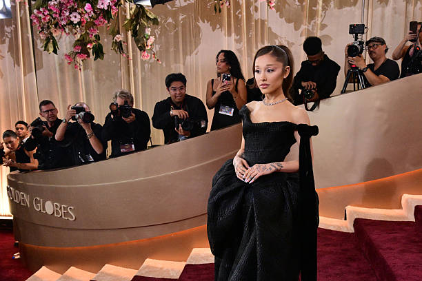 Singer-Songwriter Ariana Grande attends the 83rd annual Golden Globe Awards at the Beverly Hilton hotel in Beverly Hills, California, on January 11, 2026. / -- IMAGE RESTRICTED TO EDITORIAL USE - STRICTLY NO COMMERCIAL USE -- — frame 109/135 (612×408)