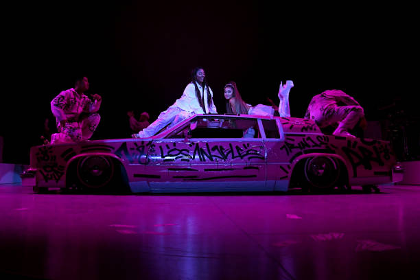 Victoria Monet and Ariana Grande perform onstage during Ariana Grande Sweetener World Tour at Staples Center on May 07, 